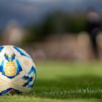 close up of official argentine soccer ball on field