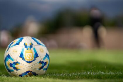 close up of official argentine soccer ball on field